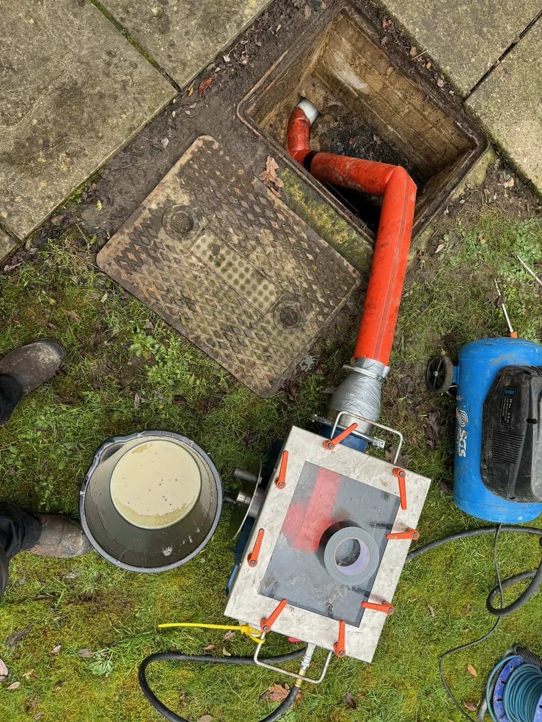 Drain relining process for blocked or damaged pipes.