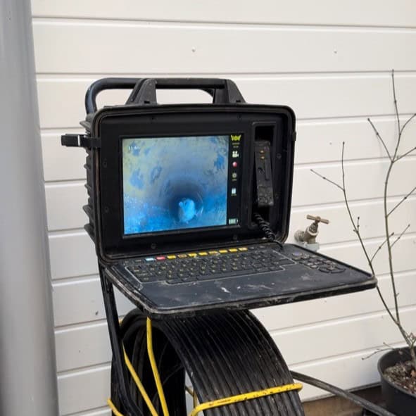Professional drain inspection camera used for pipe cleaning and maintenance.